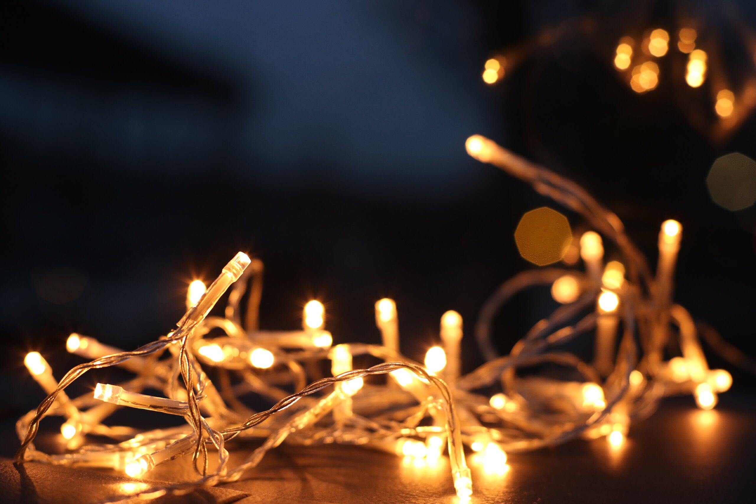 A string of white lights used in holiday decorating symbolizing navigating grief during the holidays.